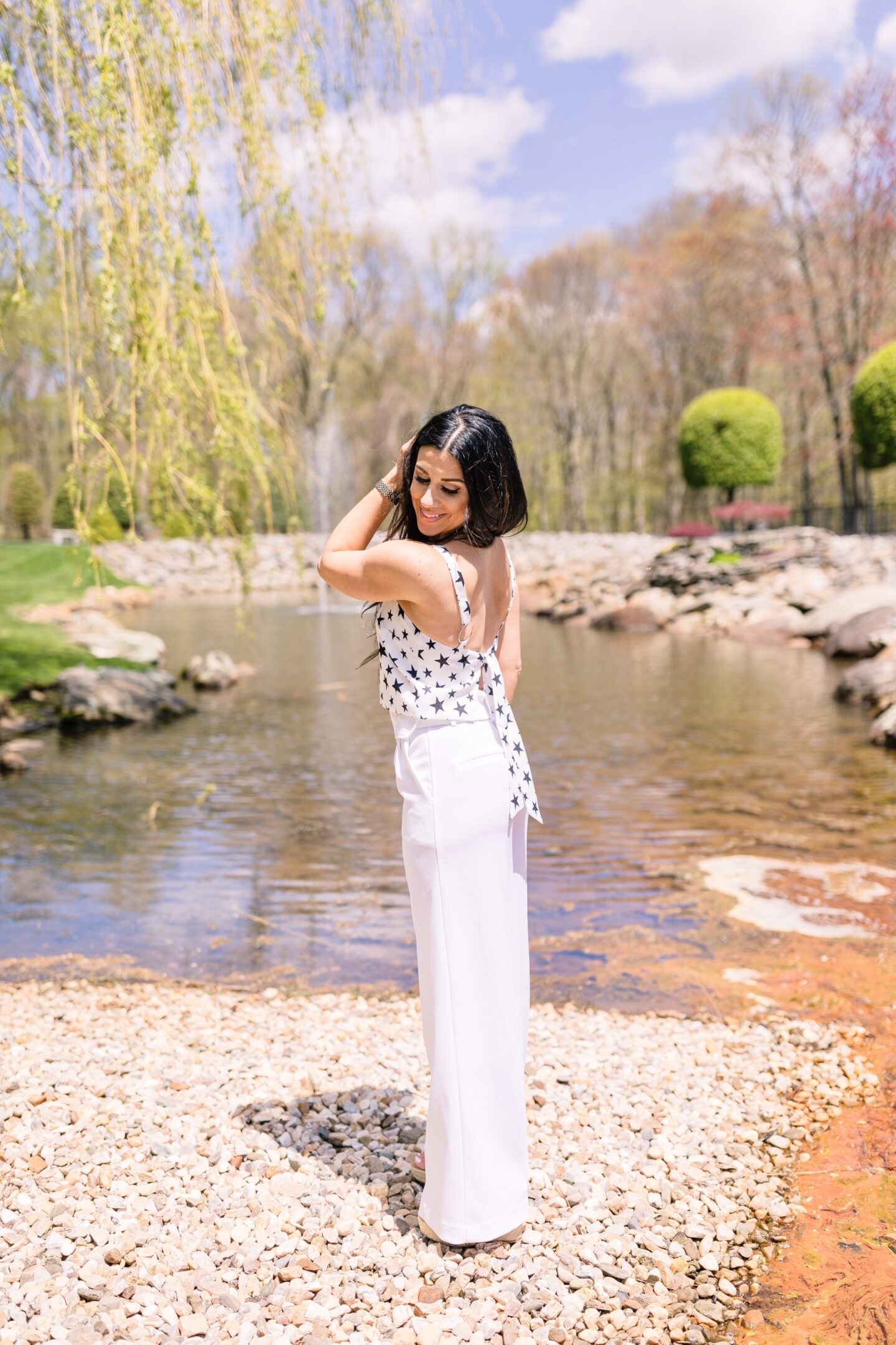 woman at the park sharing Memorial Day Weekend Sales