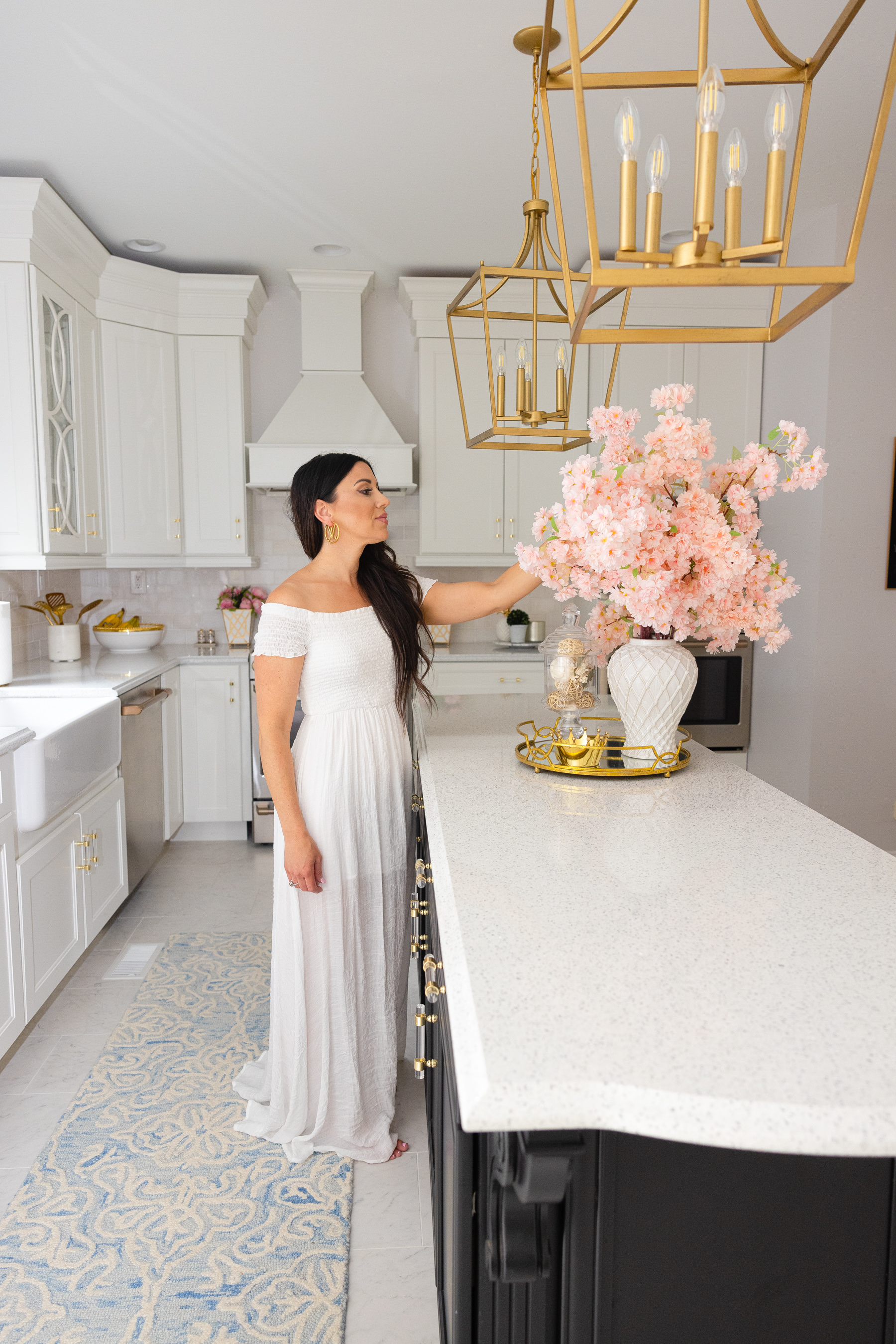 woman wearing white dress in her White and Gold Kitchen