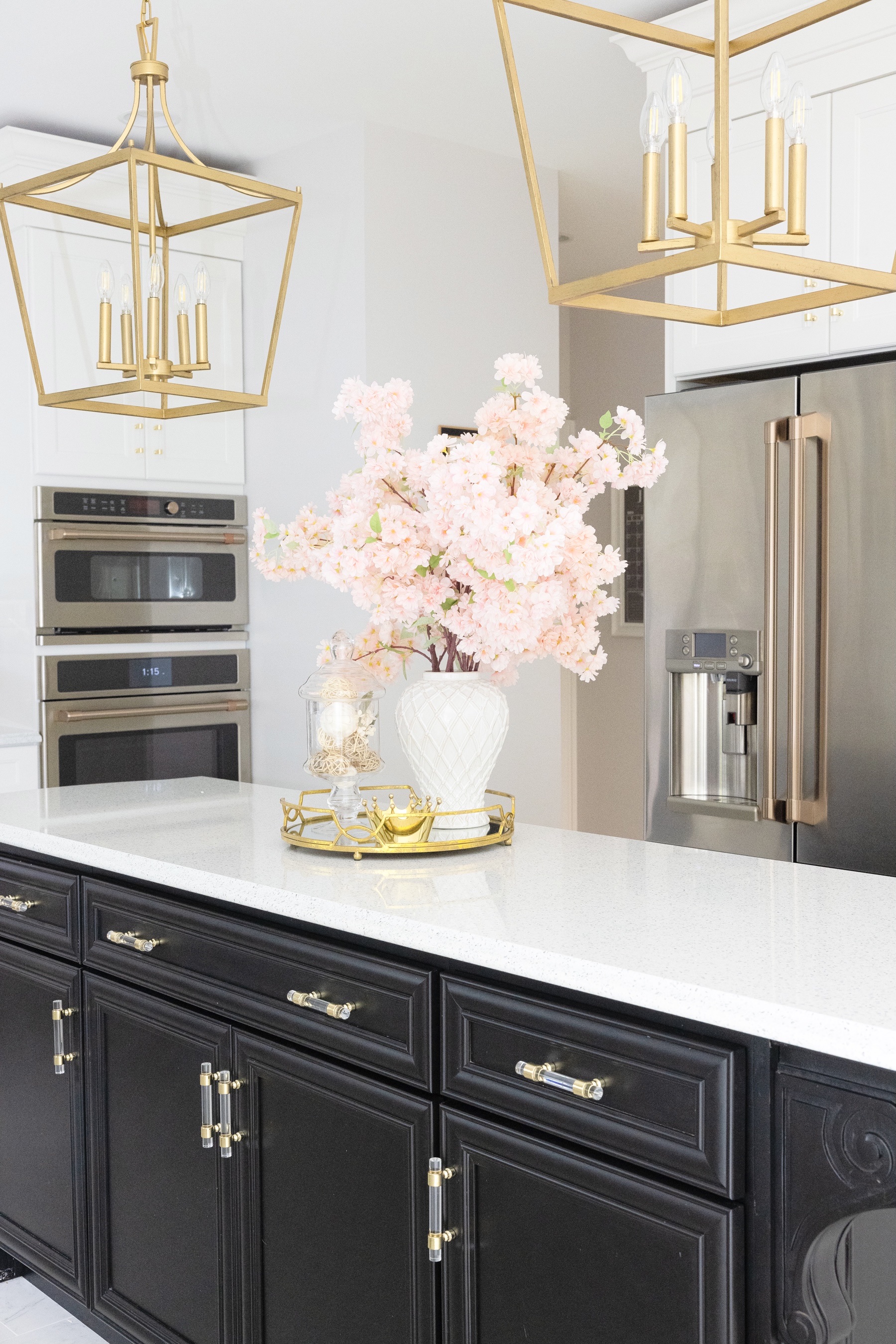 White and Gold Kitchen with flowers on the counter