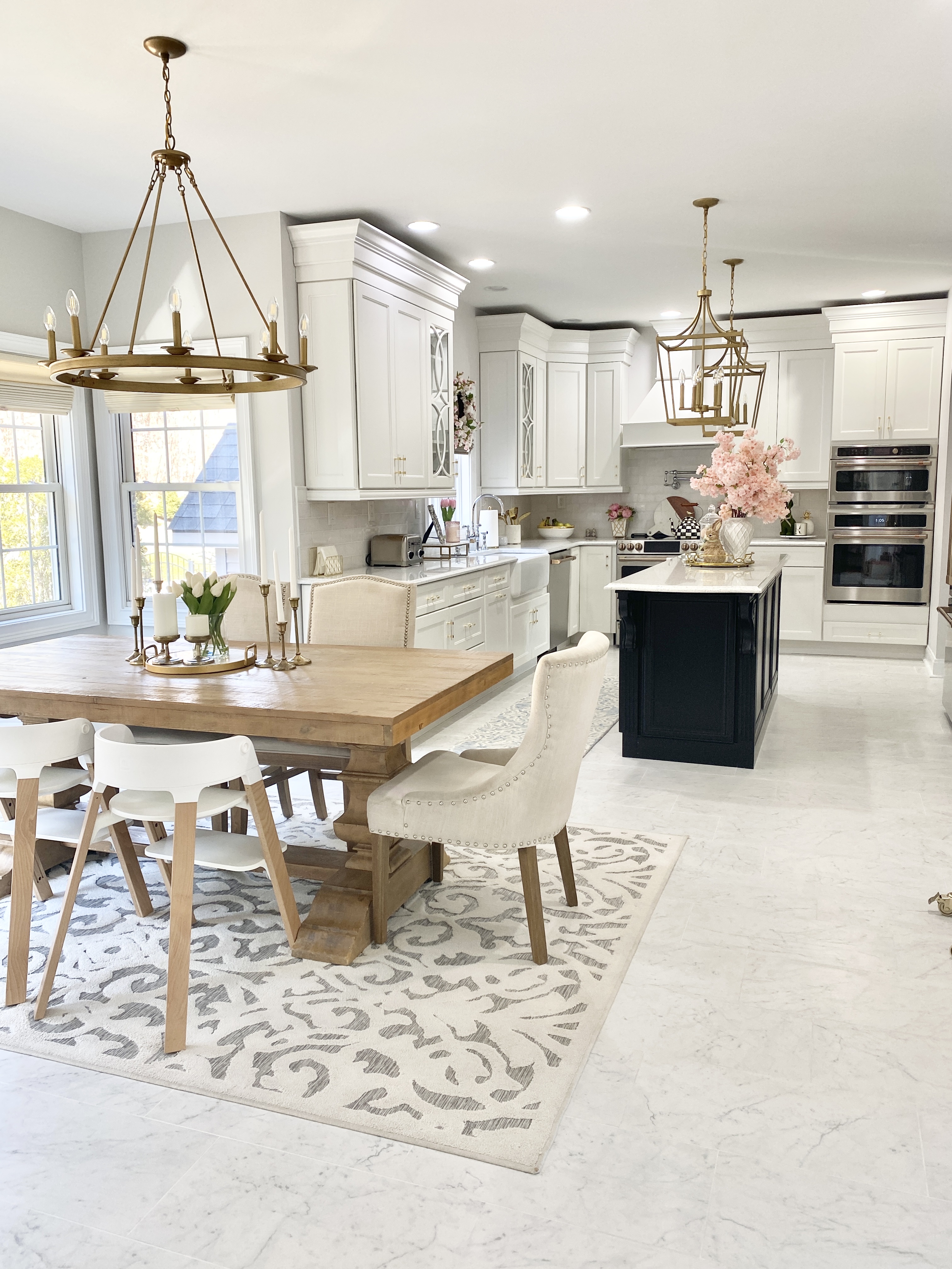 White and Gold Kitchen with wood dining table