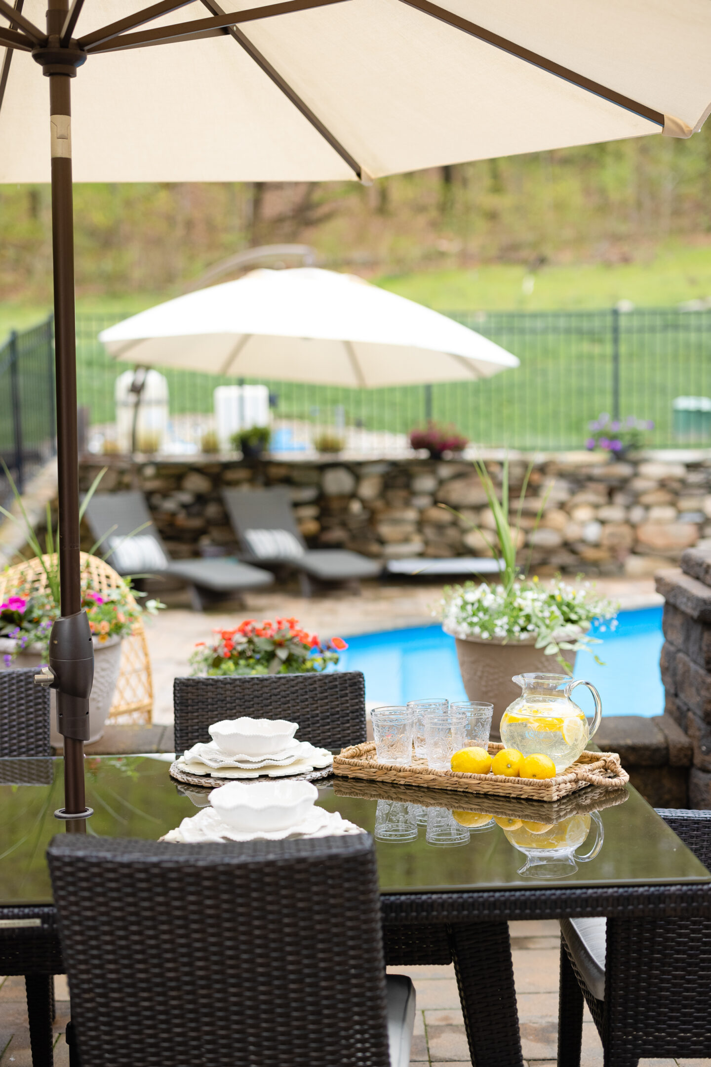 tables and chairs on the poolside for Outdoor Entertaining