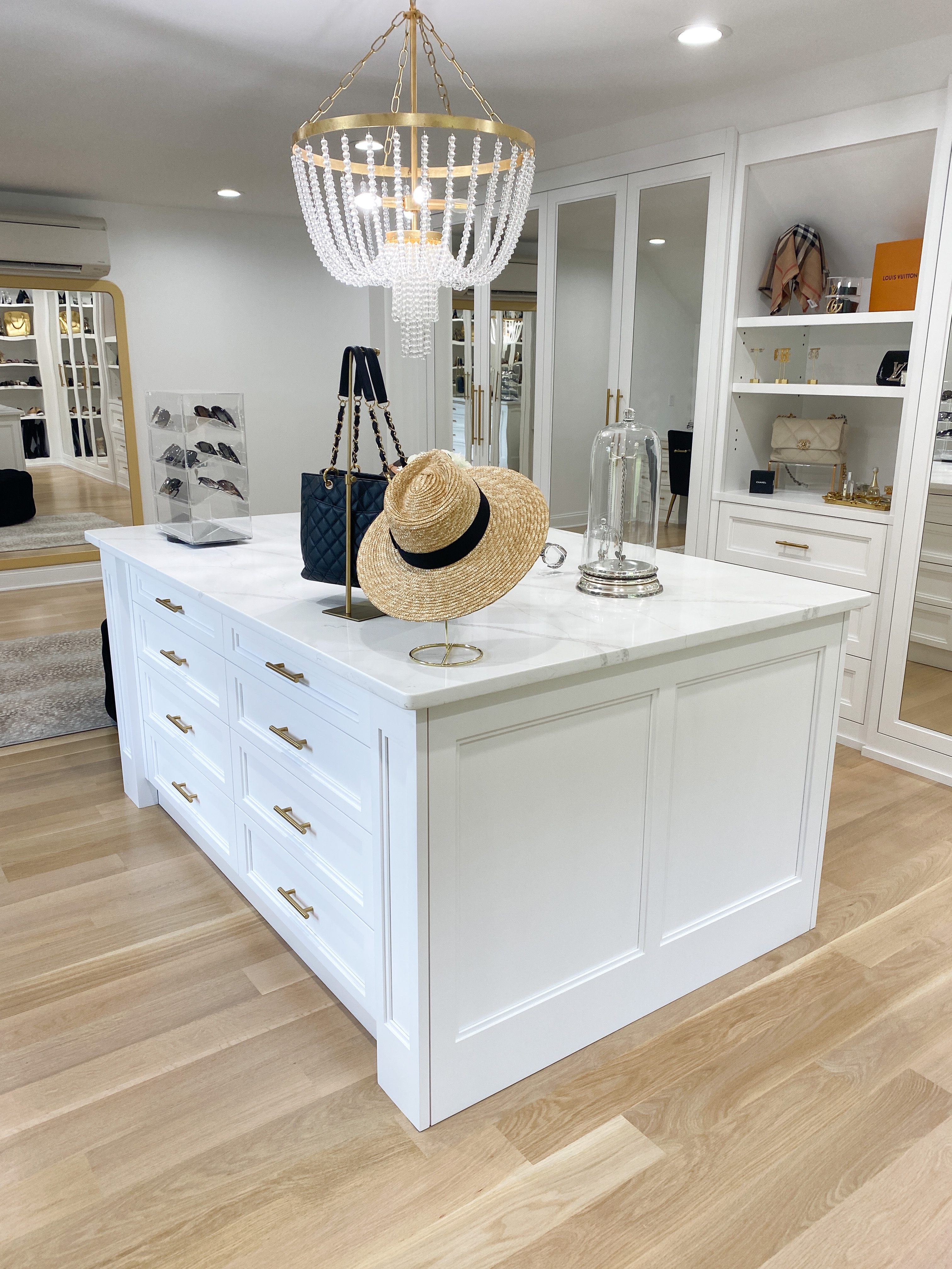 a chandelier in a walk-in close